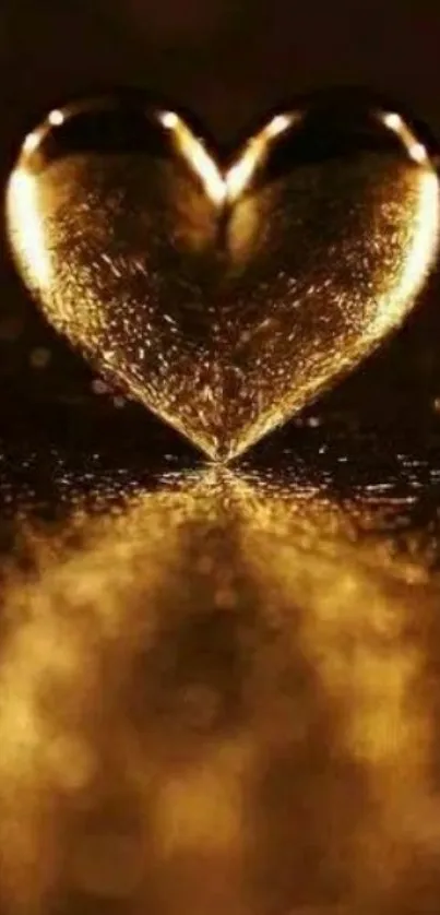 Golden heart with reflection on a dark background, creating a warm and elegant look.