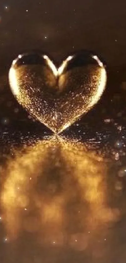 Golden heart with glowing reflection on a metallic surface.