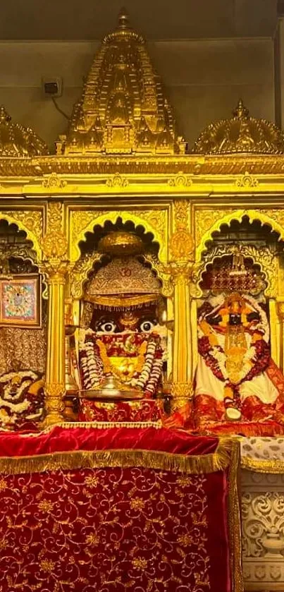 Golden Hindu temple altar with red fabrics for soothing mobile wallpaper.