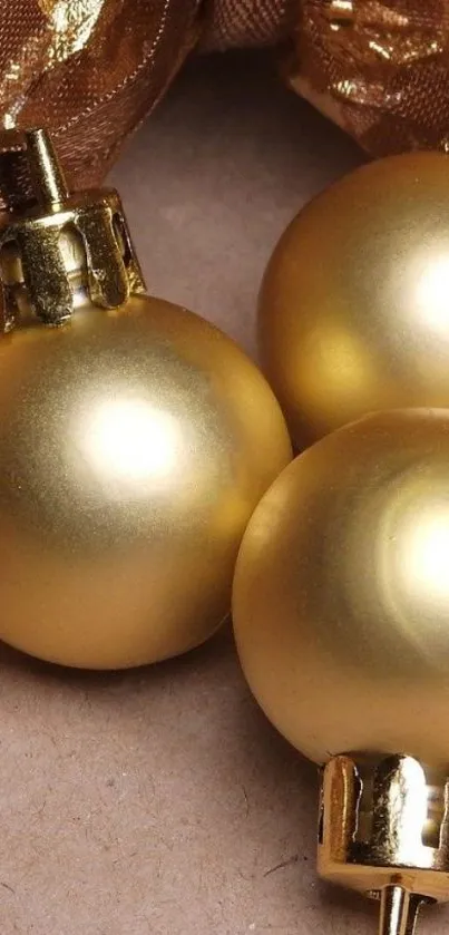 Golden Christmas ornaments on elegant background.