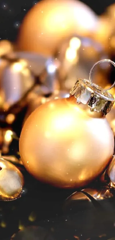 Golden ornaments and bells on evergreen branches, perfect for festive decor.