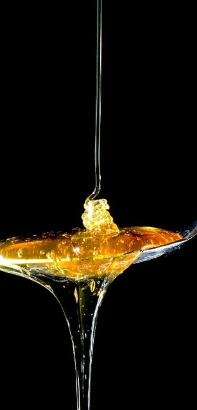 Golden honey drips luxuriously from a spoon against a black background.