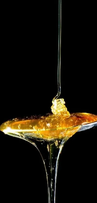 Golden honey dripping in dark background wallpaper.