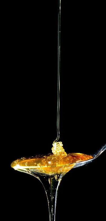 Golden honey drips from a spoon with a sleek black background.