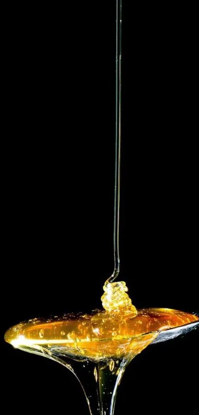 Golden honey drizzling elegantly on a spoon against black background.