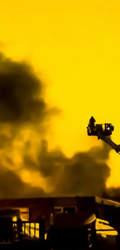 Silhouetted industrial scene against a golden sky with smoke clouds.