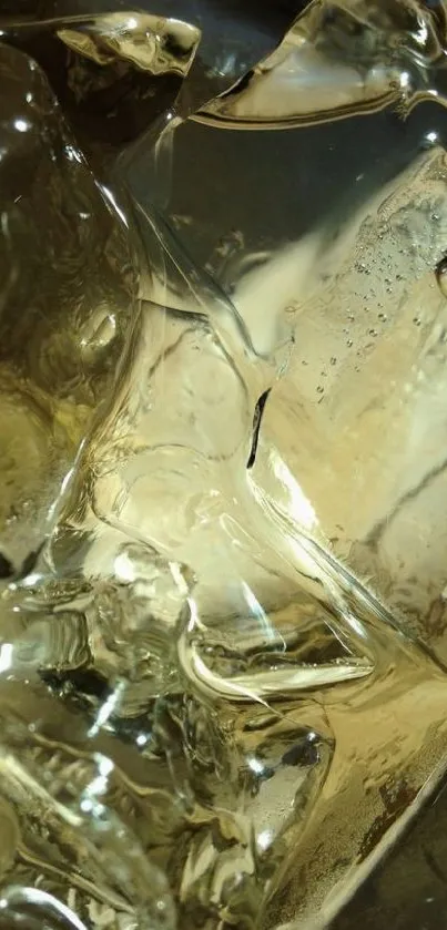 Close-up of golden ice cubes with abstract reflections.