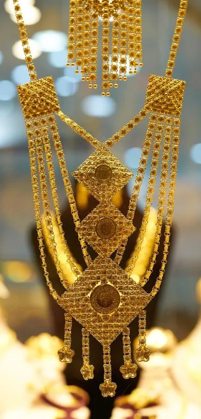 Intricate golden jewelry design on mobile wallpaper.