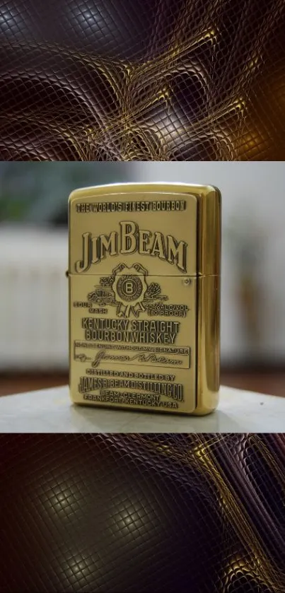 Gold Jim Beam lighter on a dark, textured background wallpaper.