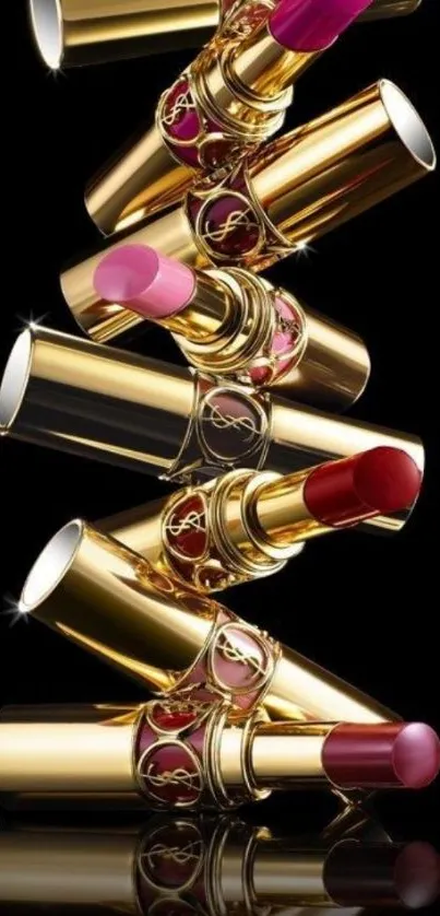 Luxurious golden lipsticks on black background.