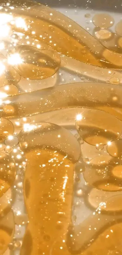 Golden liquid wallpaper with shimmering light reflections.