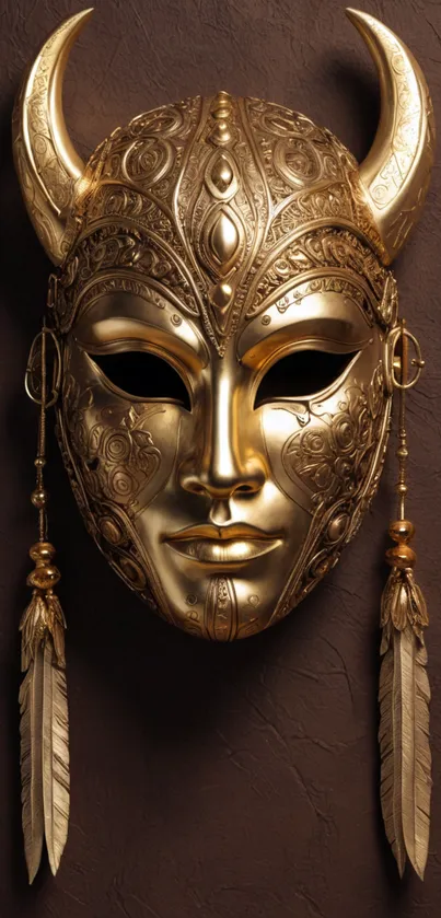 Intricate golden mask with horns on a dark background.