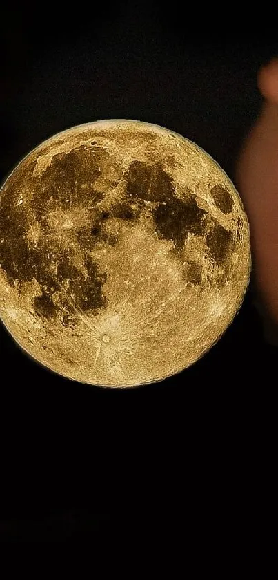 Realistic full moon with golden light against a dark sky.