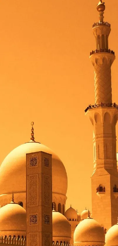 Golden silhouette of mosque with domes and minaret against the sky.