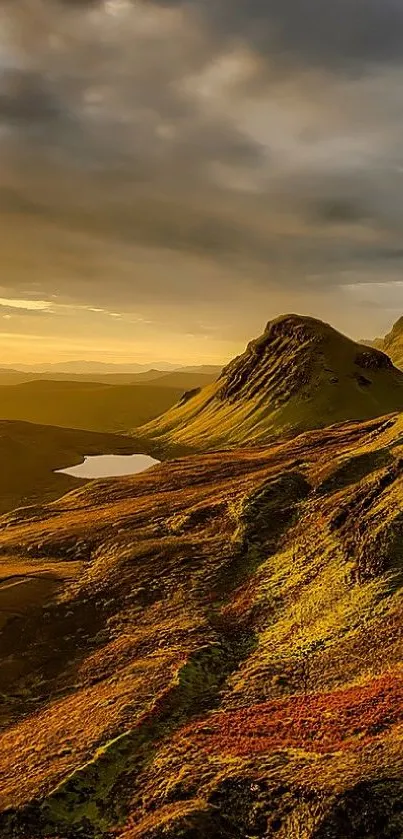 Golden mountain landscape with sunset sky and serene scenery.