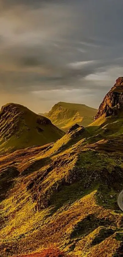 Golden sunset over scenic mountains, perfect for phone wallpaper.