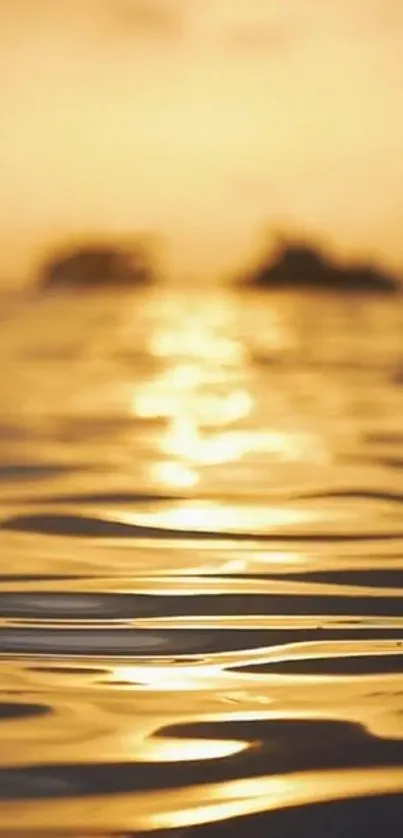 Golden sunset reflecting on ocean waves, creating a serene and tranquil atmosphere.