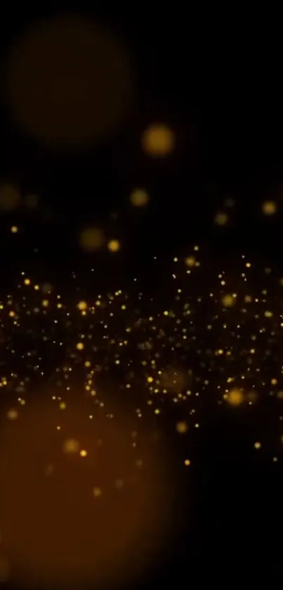 Golden particles glowing against a black background, creating an elegant mobile wallpaper.