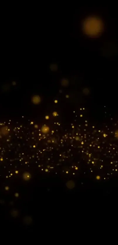 Golden particles floating on a dark background.