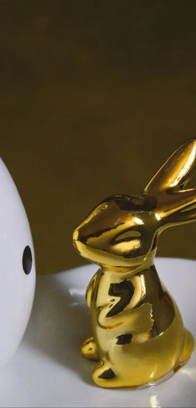 Golden rabbit with a polka-dotted egg design.