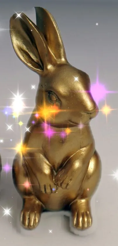 Golden rabbit sculpture with colorful sparkles.