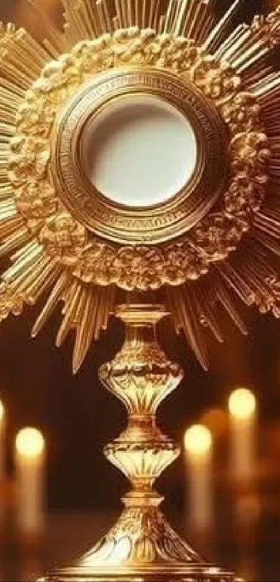 Ornate golden monstrance with glowing candles.