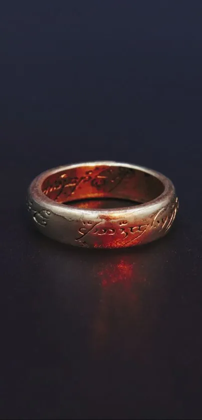 Majestic gold ring with fiery glow on dark background.