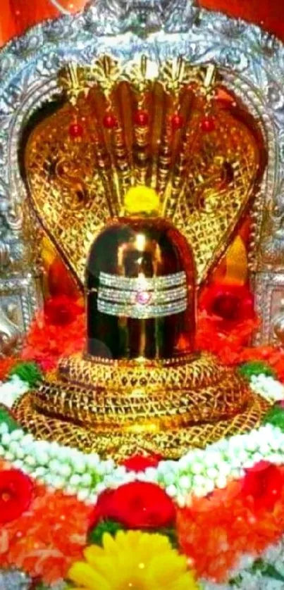 Golden Shiva lingam adorned with flowers and ornate design.