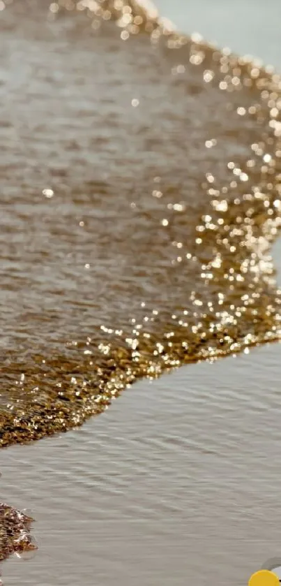 Golden waves softly lap against the sandy beach, creating a serene and tranquil scene.