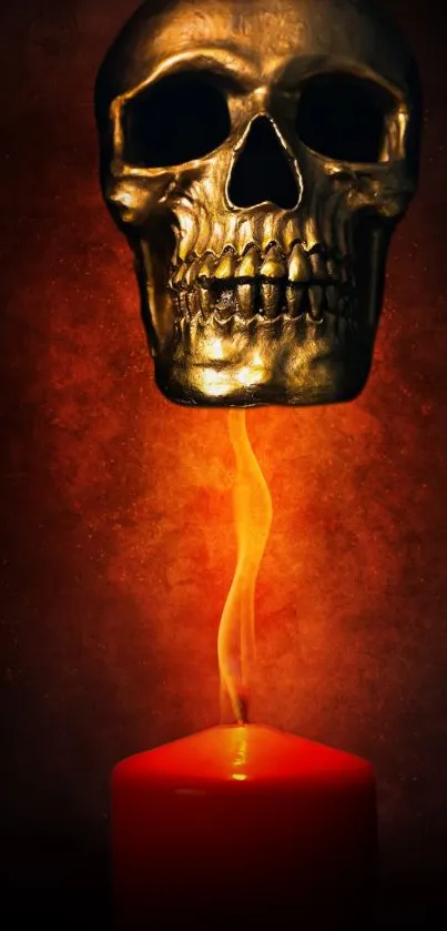 Golden skull floating above a red candle with dark background.