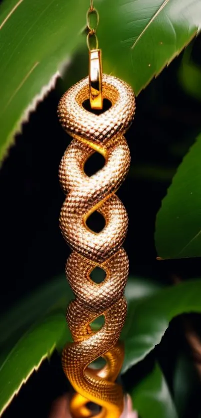 Golden snake ornament with lush green leaves backdrop.