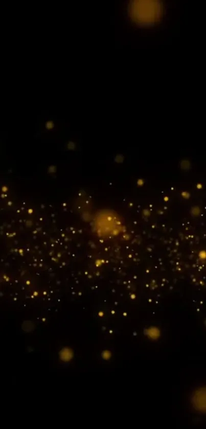 Golden sparkles on a dark abstract wallpaper.