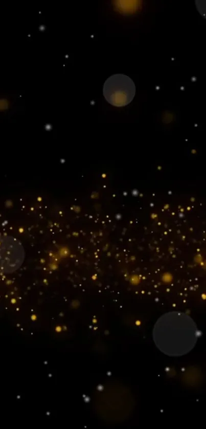 Golden sparkle abstract wallpaper with dark background and shimmering particles.