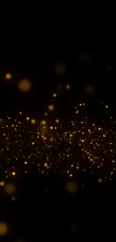 Golden sparkle abstract wallpaper with glowing dots on black background.