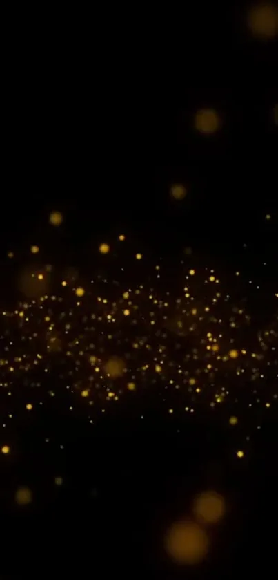 Golden sparkles on a black background mobile wallpaper.