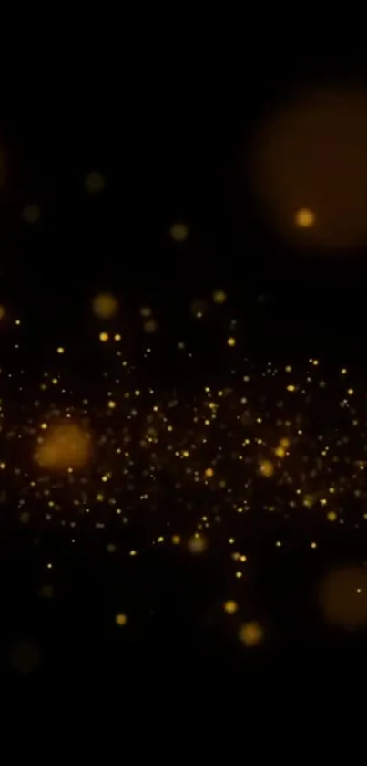 Golden sparkles on a dark background for mobile wallpaper.