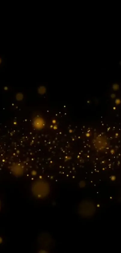 Golden sparkle particles on dark wallpaper.