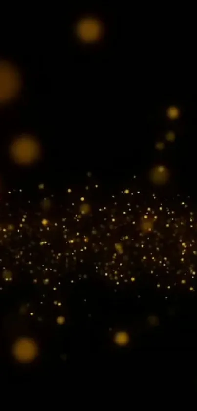 Golden sparkle particles on black background, ideal for mobile wallpaper.