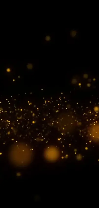 Golden sparkles on a dark background wallpaper.