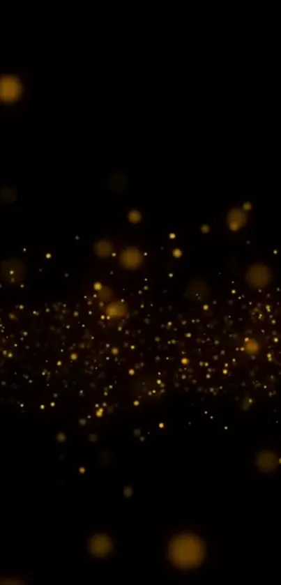 Golden sparkles on a black background for phone wallpaper.