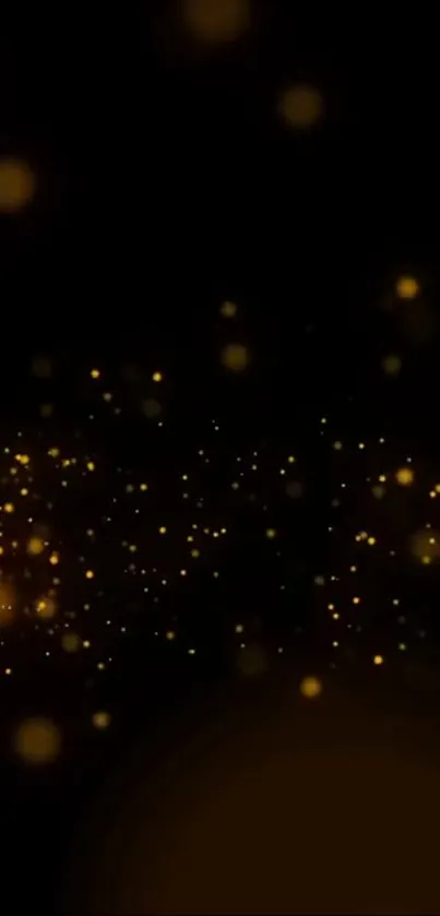 Elegant gold sparkle wallpaper with glowing particles on black background.