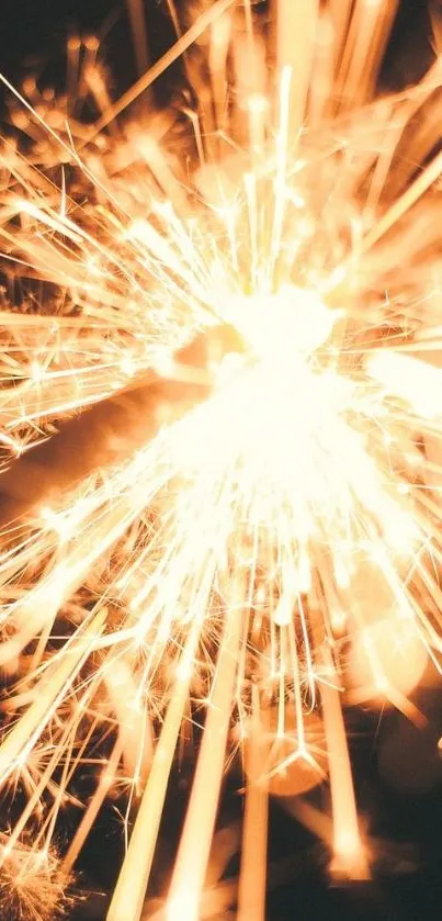 Dynamic golden sparkler explosion on dark background wallpaper.