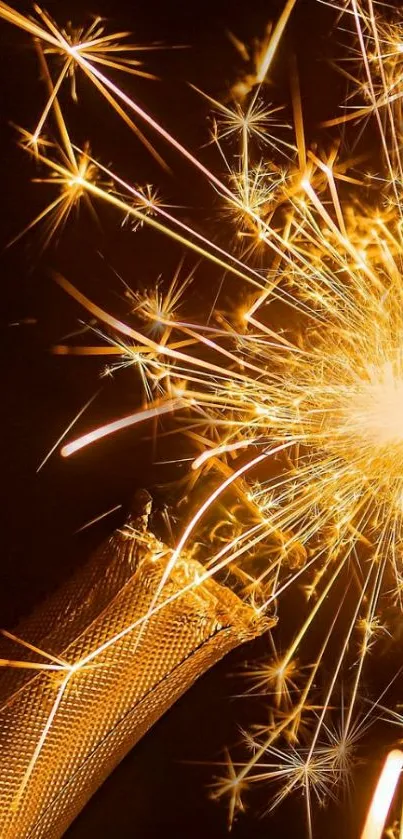 Golden sparkler creating a bright burst on a dark background.