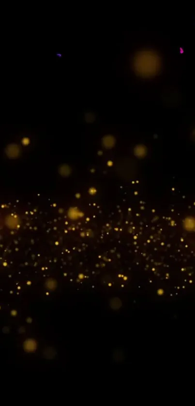 Golden sparkles on black background mobile wallpaper.