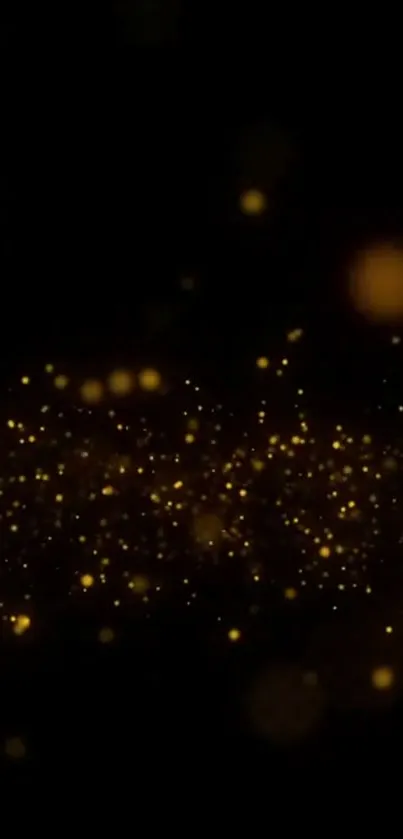 Golden sparkles on a dark background mobile wallpaper.