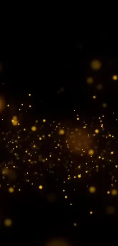 Golden sparkles on dark background wallpaper