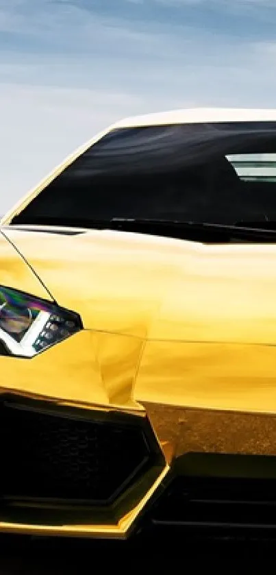 Golden sports car under a clear sky.