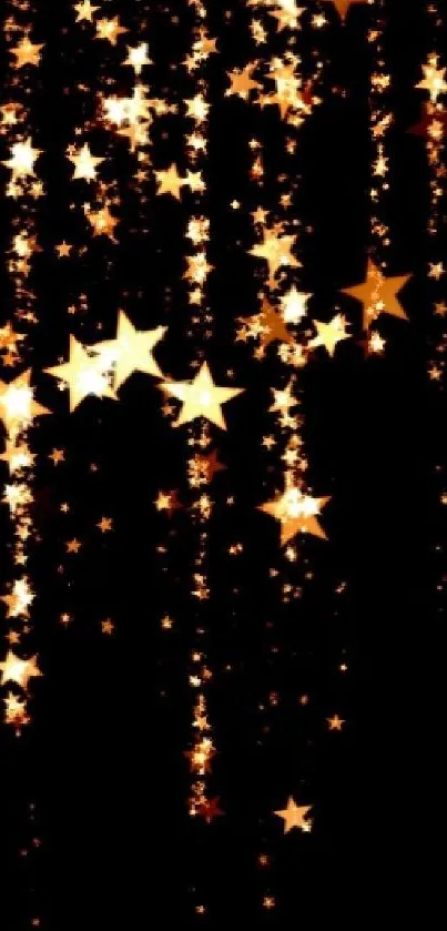 Golden stars cascading against a black background in a night sky wallpaper scene.