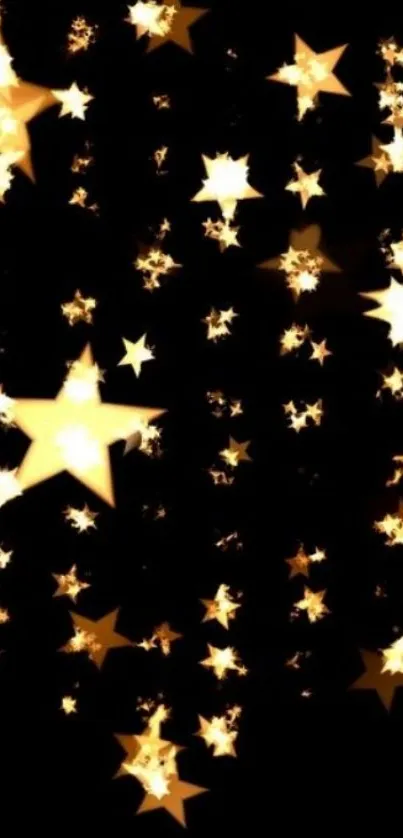 Golden stars glowing on dark night sky wallpaper.