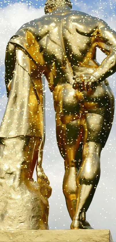 Golden statue with blue sky mobile wallpaper.